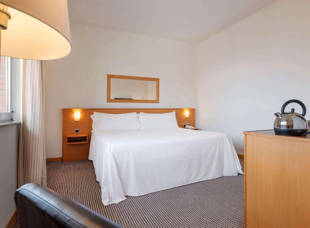 Postel nebo postele na pokoji v ubytování Hotel Zentral León