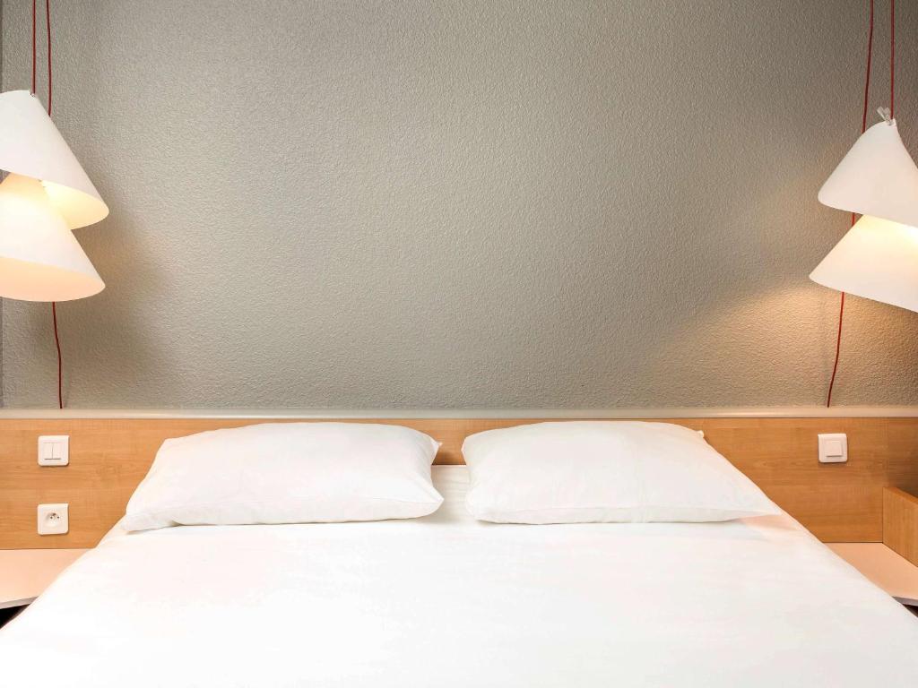 Postel nebo postele na pokoji v ubytování ibis Montélimar Nord