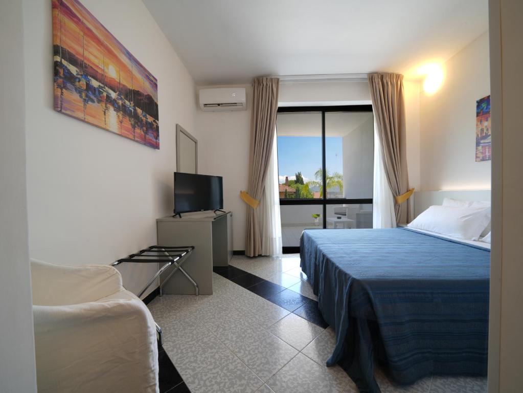 Postel nebo postele na pokoji v ubytování Hotel Club Clorinda nuova gestione 2024