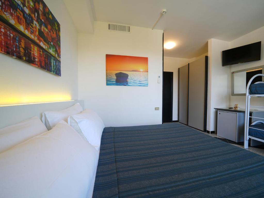 Postel nebo postele na pokoji v ubytování Hotel Club Clorinda nuova gestione 2024