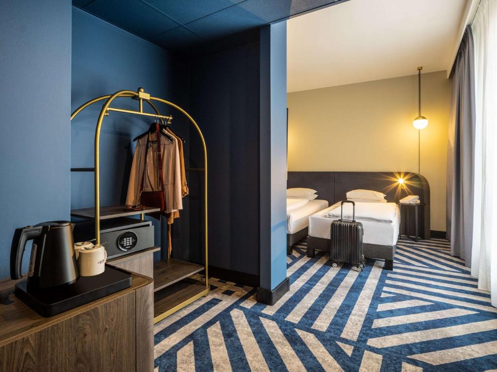Łóżko lub łóżka w pokoju w obiekcie Hotel Mercure Wien City