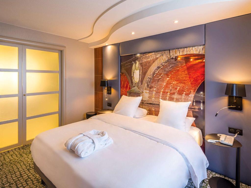 Postel nebo postele na pokoji v ubytování Hotel Mercure Toulouse Centre Compans