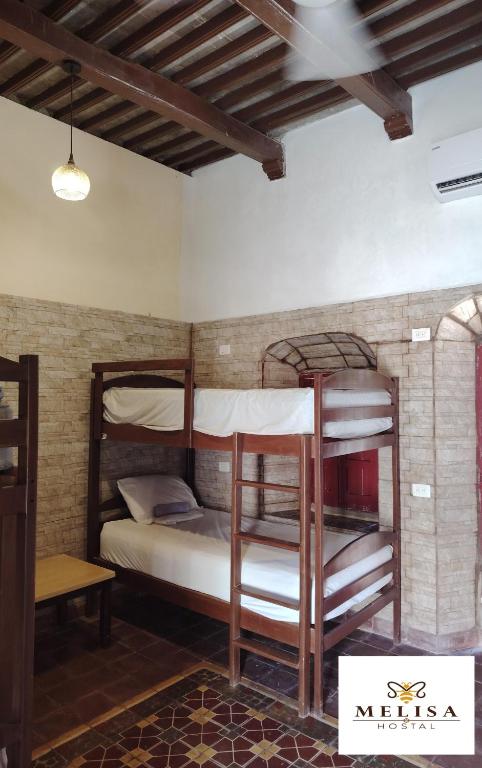 Postel nebo postele na pokoji v ubytování MELISA HOSTAL