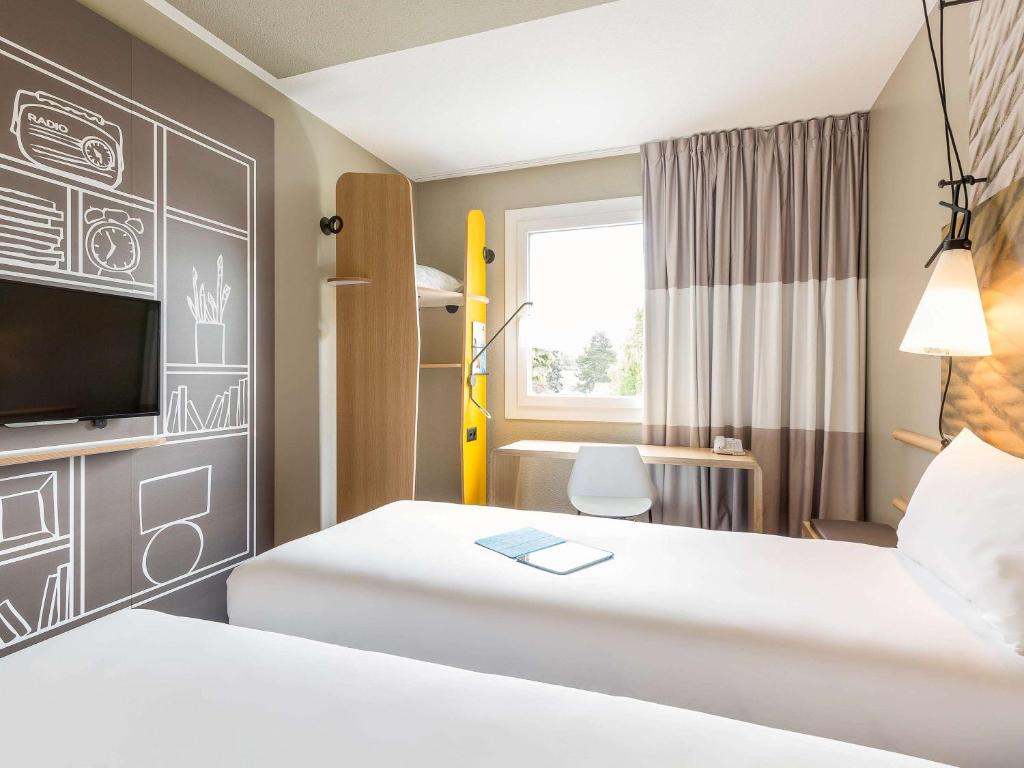 Postel nebo postele na pokoji v ubytování ibis Genève Aéroport