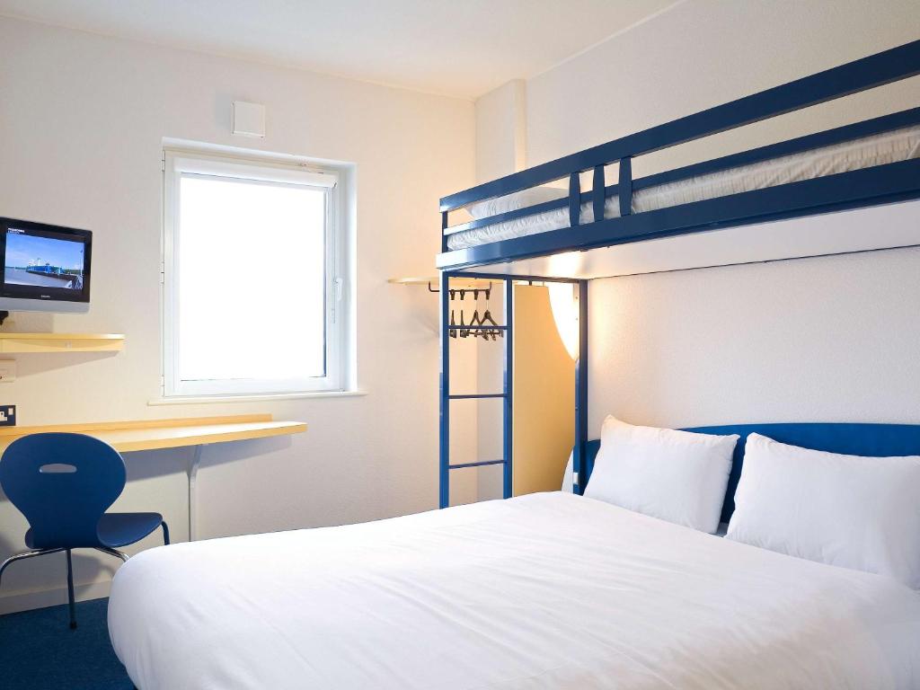 Ein Bett oder Betten in einem Zimmer der Unterkunft Ibis Budget Graz City