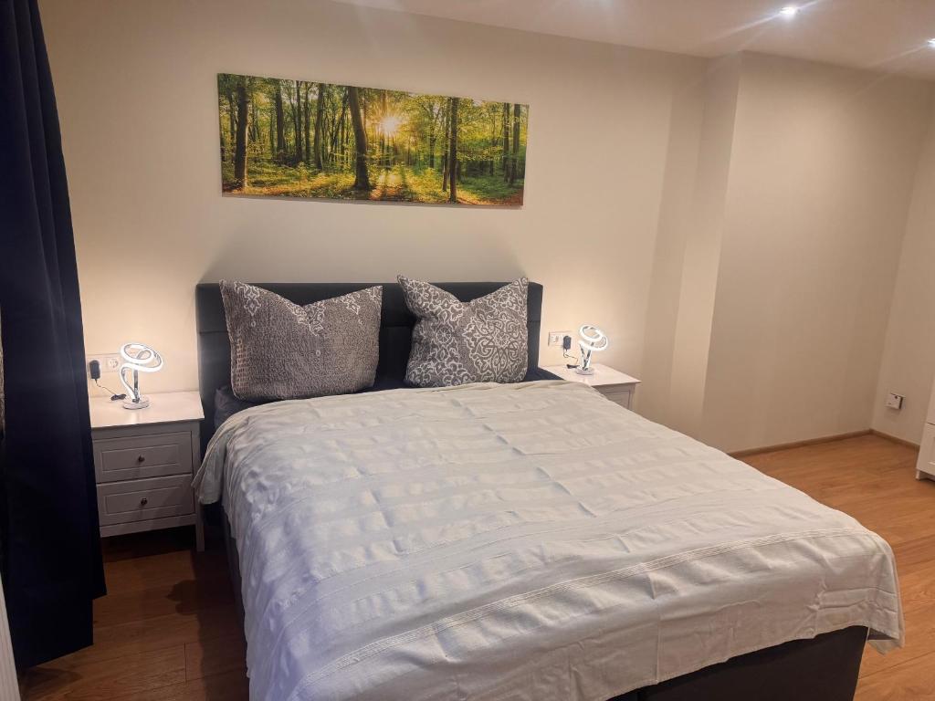 Ένα ή περισσότερα κρεβάτια σε δωμάτιο στο Oneo-Plaza-Apartments