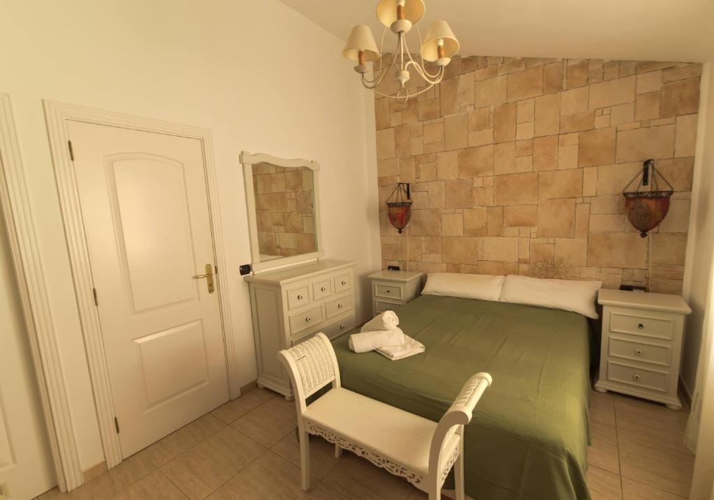 A bed or beds in a room at Casa Sagittarius Ocean view