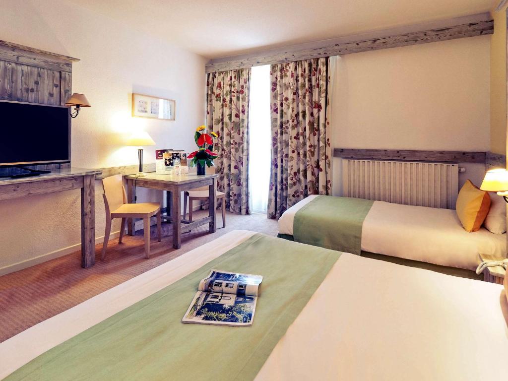 Postel nebo postele na pokoji v ubytování Mercure Millau