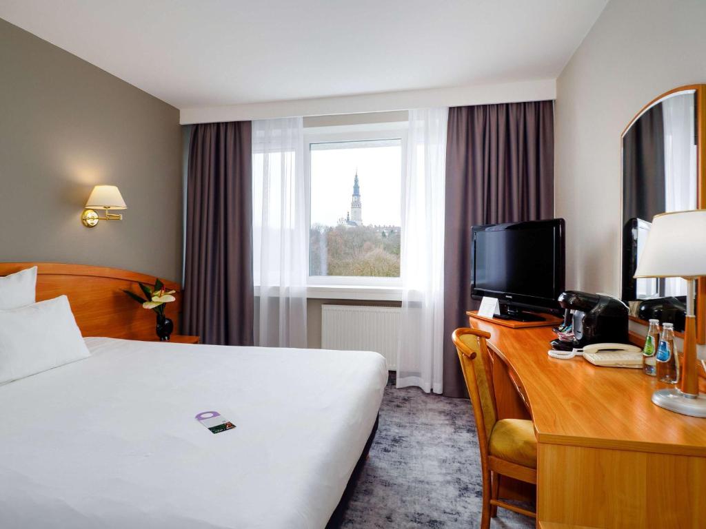 Posteľ alebo postele v izbe v ubytovaní Mercure Czestochowa Centrum