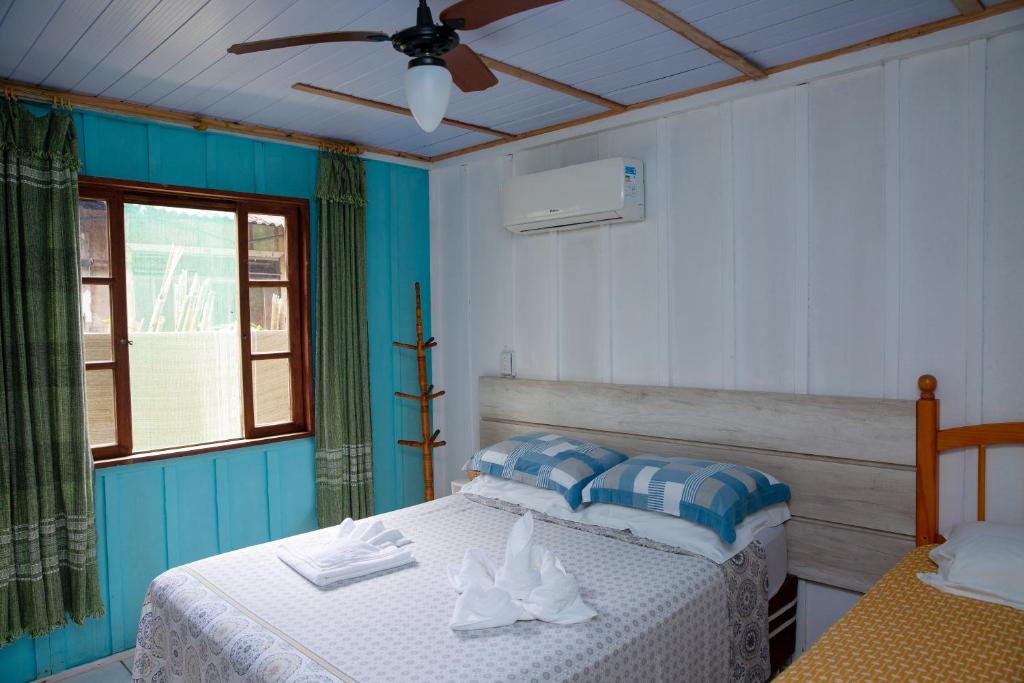Cama ou camas em um quarto em Pousada Canto da Sereia