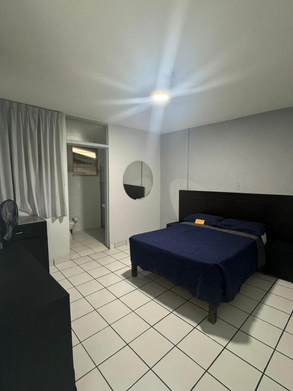 Postel nebo postele na pokoji v ubytování Hotel Urban Matamoros