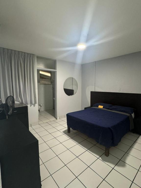 Postel nebo postele na pokoji v ubytování Hotel Urban Matamoros