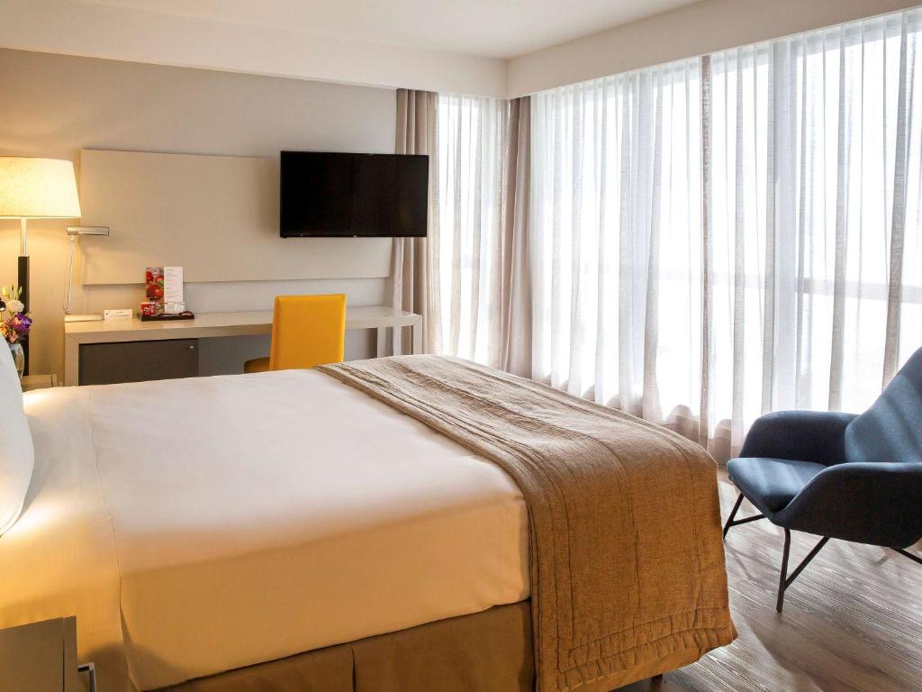 Postel nebo postele na pokoji v ubytování Novotel Florianopolis