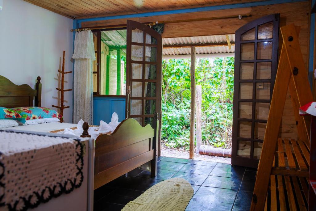 Cama ou camas em um quarto em Pousada Canto da Sereia
