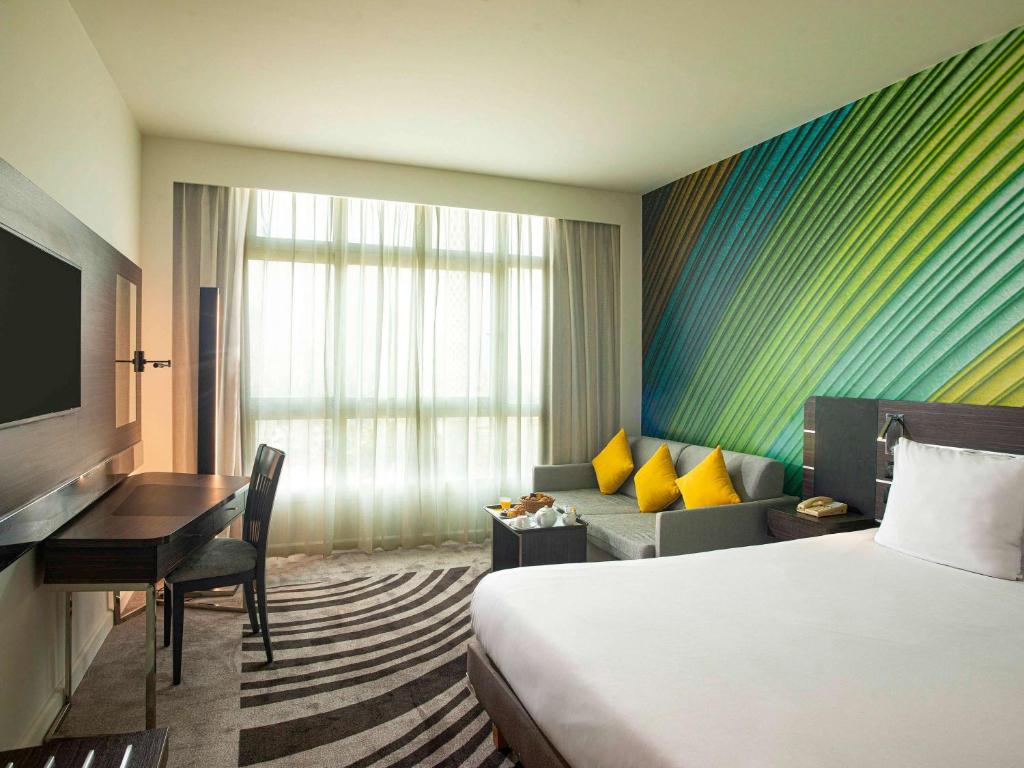 Postel nebo postele na pokoji v ubytování Novotel Cairo El Borg