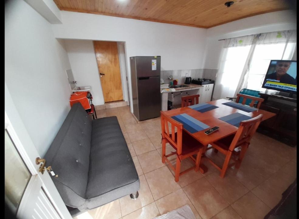 an aerial view of a kitchen with a table and a couch at Residencial GM 1 Dormitorio in San Vicente