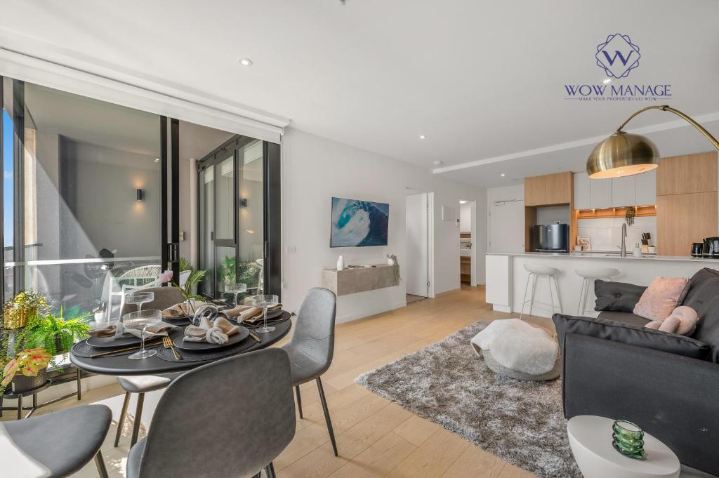 a living room with a table and chairs and a couch at WOW Self-Contained Apartment on Hall in Melbourne