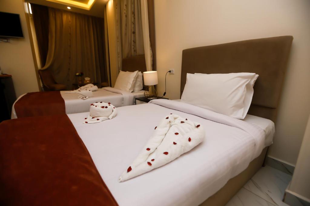 Postel nebo postele na pokoji v ubytování Pyramids Palace INN