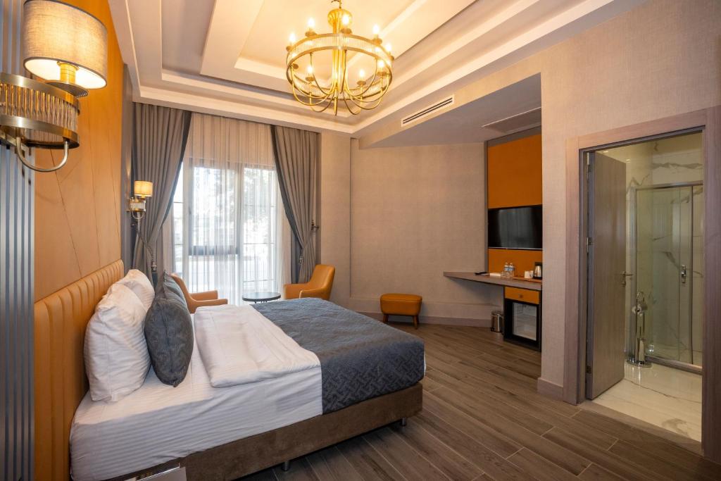 Postel nebo postele na pokoji v ubytování Icon Hotel Bomonti