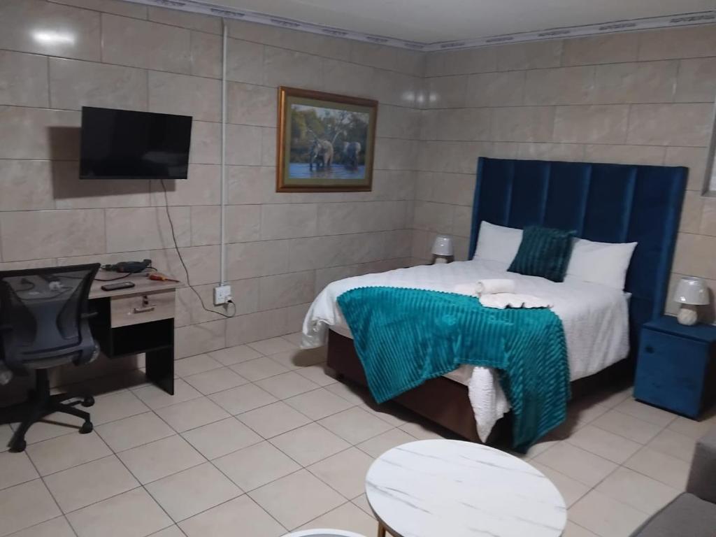 Postel nebo postele na pokoji v ubytování Whizzy Lifestyle Lodge