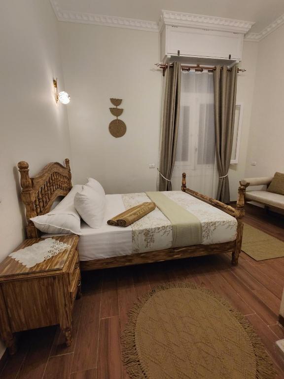 Postel nebo postele na pokoji v ubytování Champollion Palace