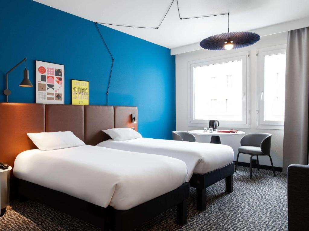 Postel nebo postele na pokoji v ubytování ibis Lausanne Centre