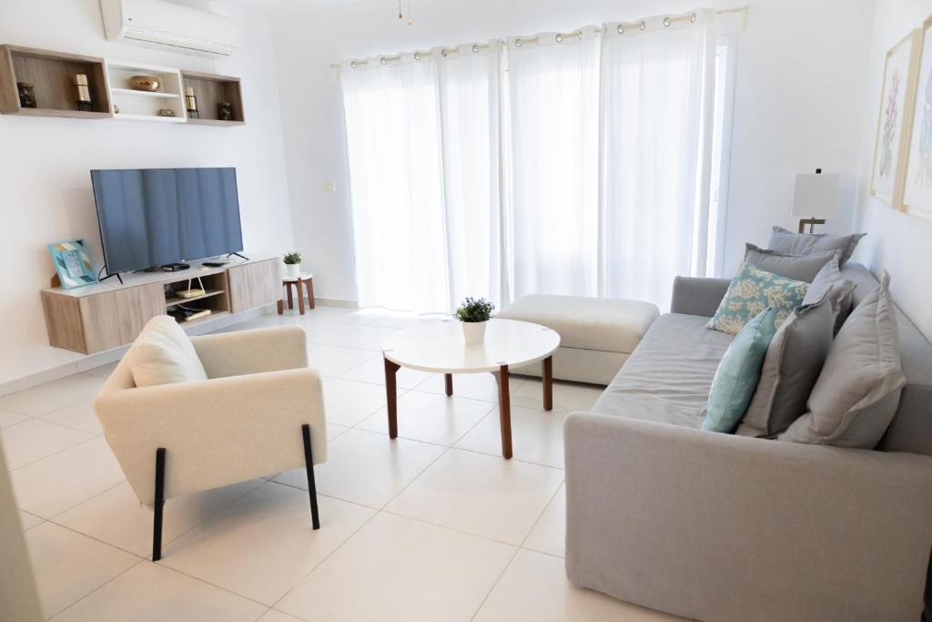 TV a/nebo společenská místnost v ubytování Ka' Romana Residences