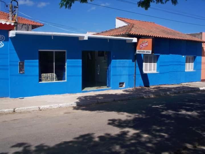 a blue building on the side of a street at Pousada Azul in Jaguarão
