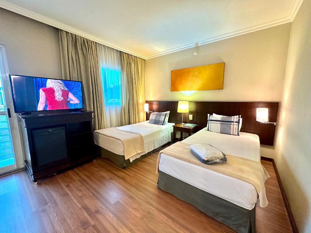 Postel nebo postele na pokoji v ubytování Apart Hotel Premium Verbo Divino Morumbi