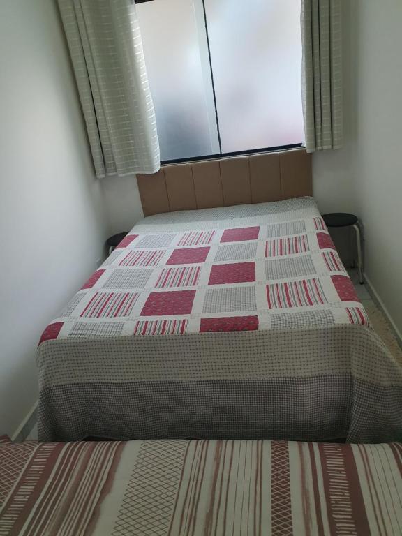 Postel nebo postele na pokoji v ubytování Quarto & Conforto