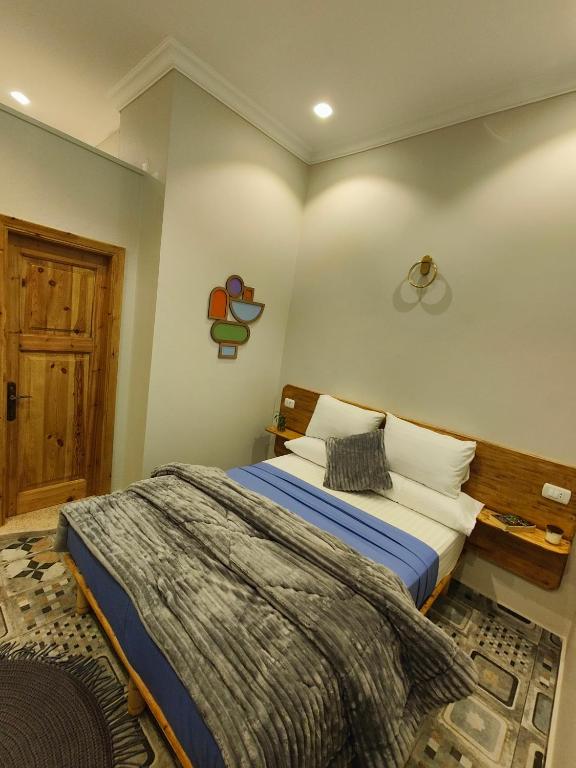 Postel nebo postele na pokoji v ubytování Champollion Palace