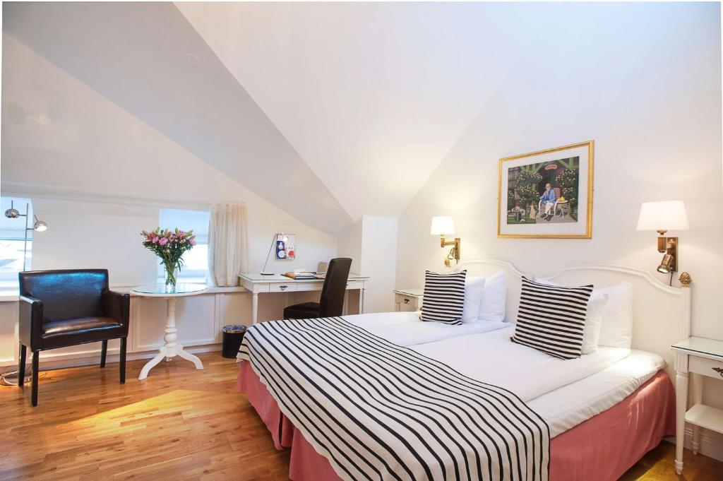 Postel nebo postele na pokoji v ubytování Hotel Kung Carl, WorldHotels Crafted