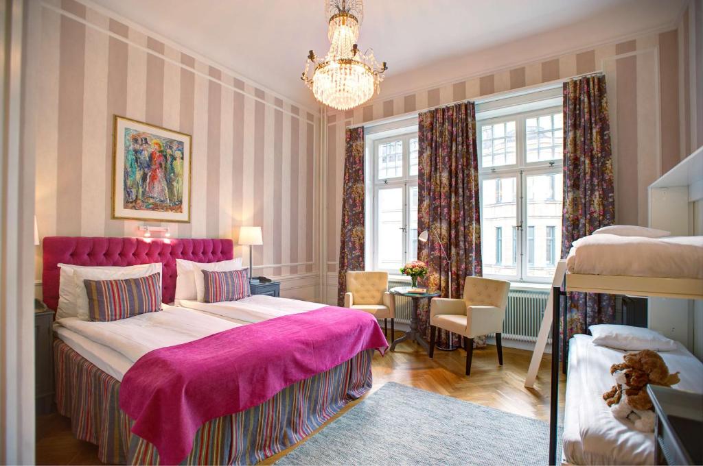 Postel nebo postele na pokoji v ubytování Hotel Kung Carl, WorldHotels Crafted