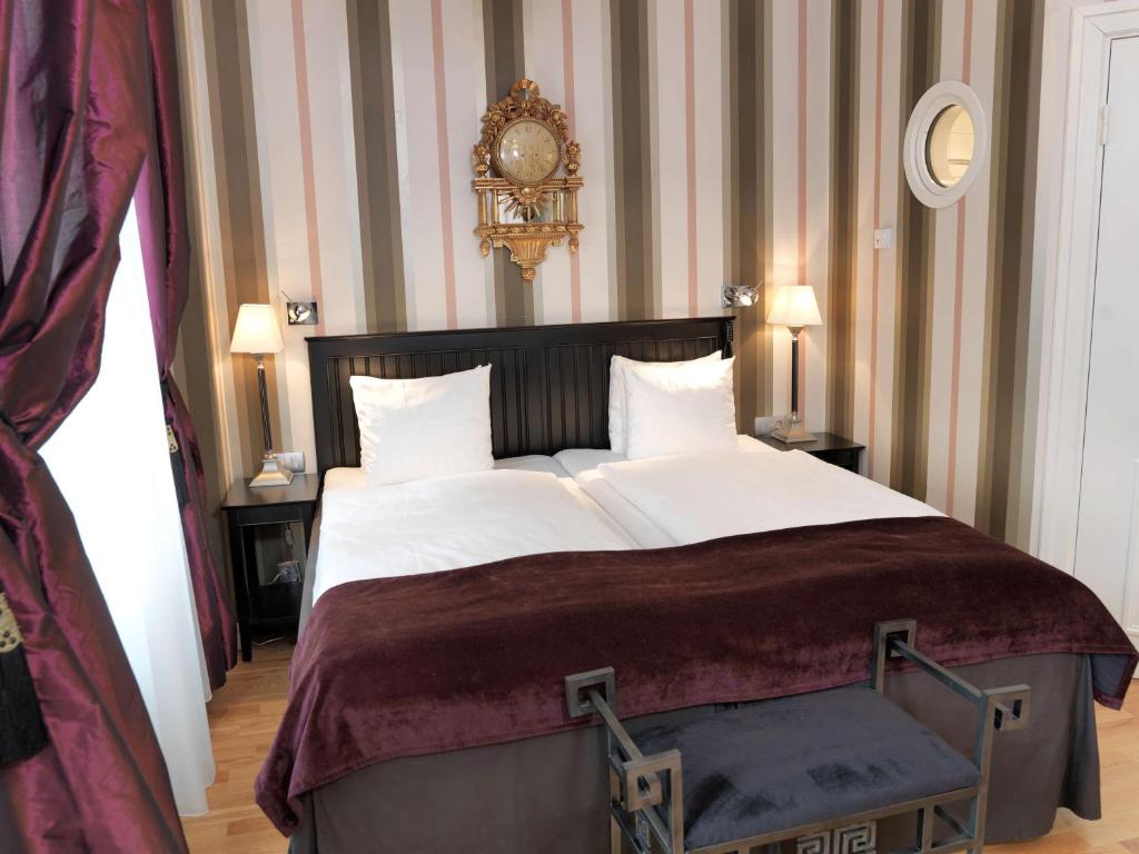 Postel nebo postele na pokoji v ubytování Hotel Kung Carl, WorldHotels Crafted