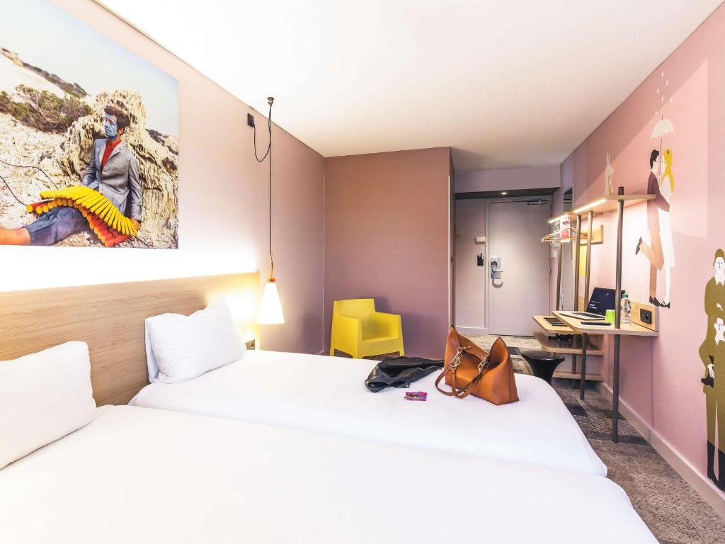 Postel nebo postele na pokoji v ubytování ibis Styles Lyon Centre Confluence
