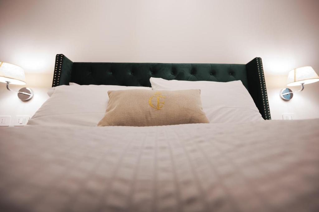 Postel nebo postele na pokoji v ubytování Carlo Felice Boutique Hotel