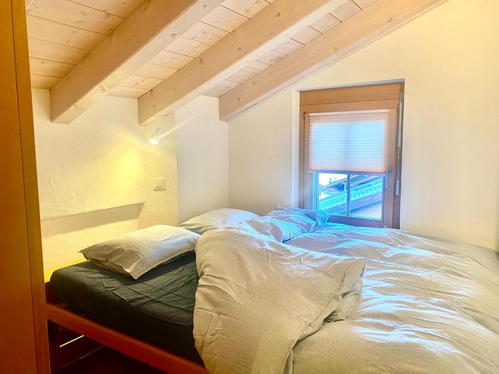Postel nebo postele na pokoji v ubytování Heidahüs Penthouse