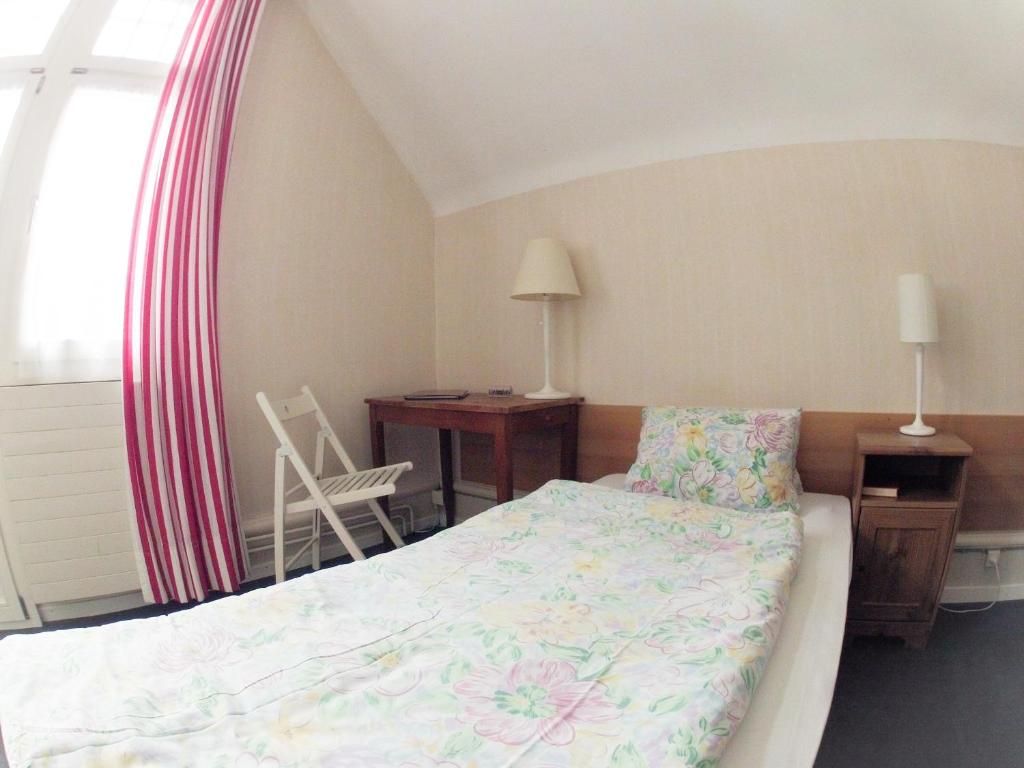 Postel nebo postele na pokoji v ubytování BasicRooms Hotel