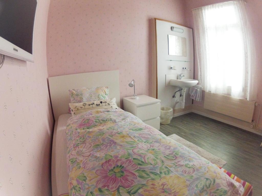 Postel nebo postele na pokoji v ubytování BasicRooms Hotel