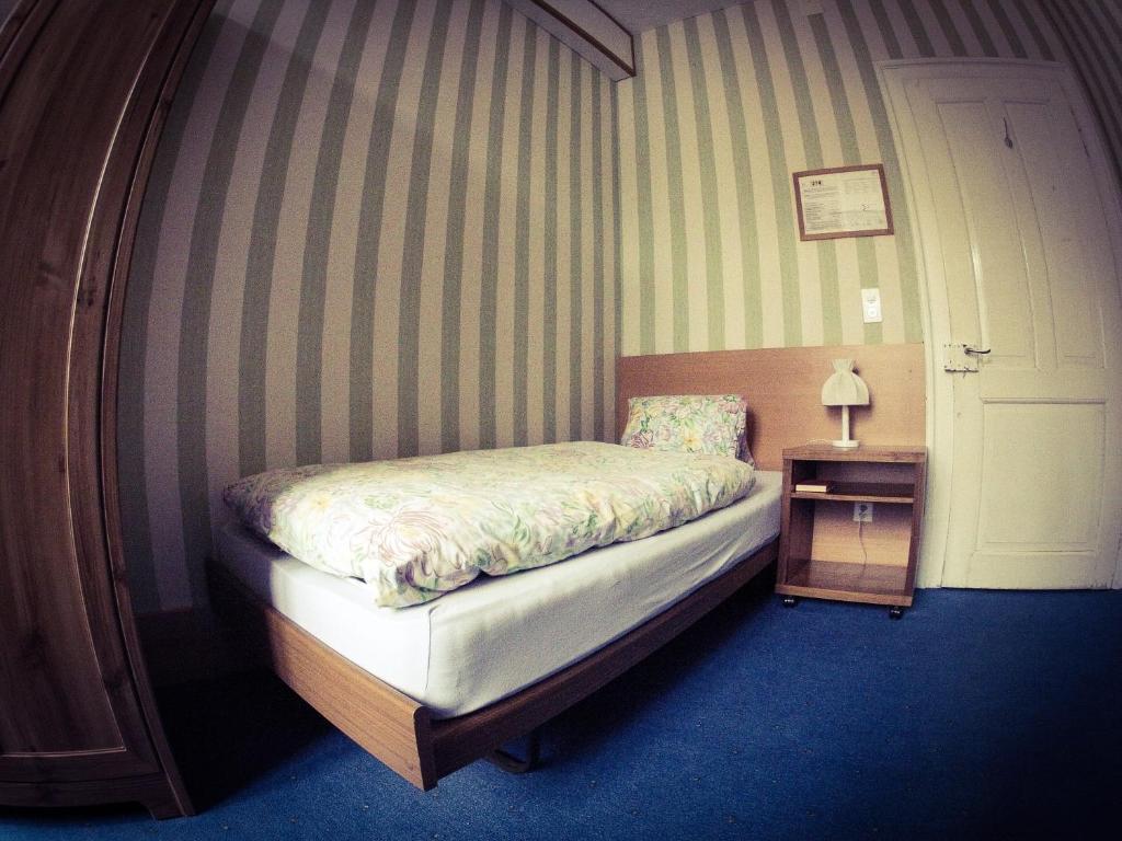 Postel nebo postele na pokoji v ubytování BasicRooms Hotel