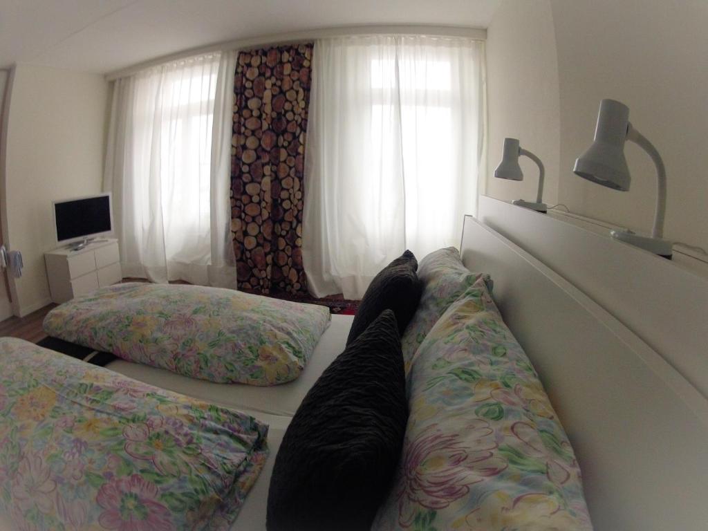 Postel nebo postele na pokoji v ubytování BasicRooms Hotel
