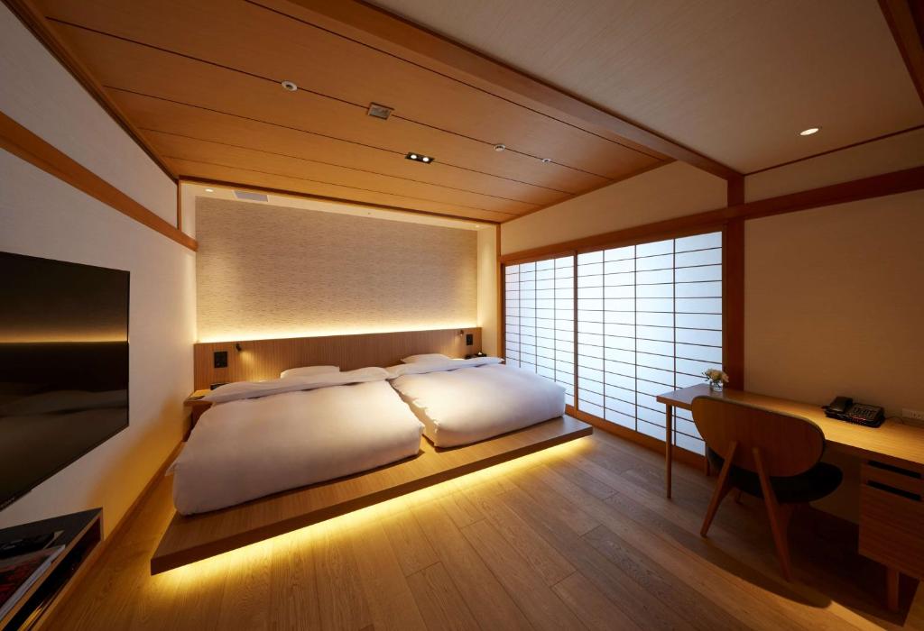 Postel nebo postele na pokoji v ubytování Hilton Nagoya Hotel