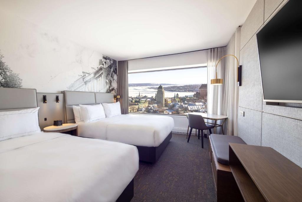 Postel nebo postele na pokoji v ubytování Hilton Quebec