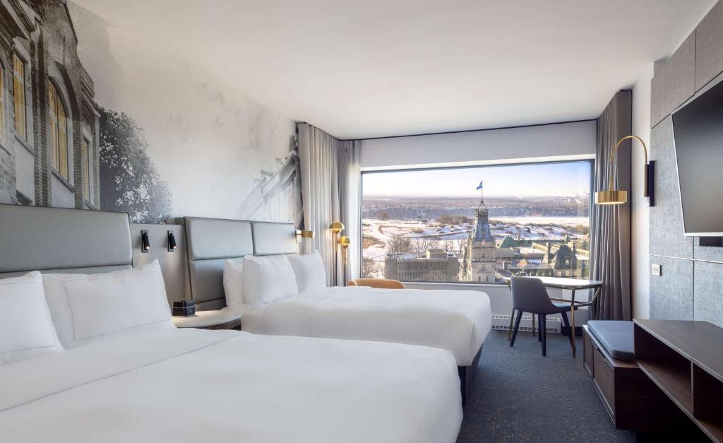 Postel nebo postele na pokoji v ubytování Hilton Quebec