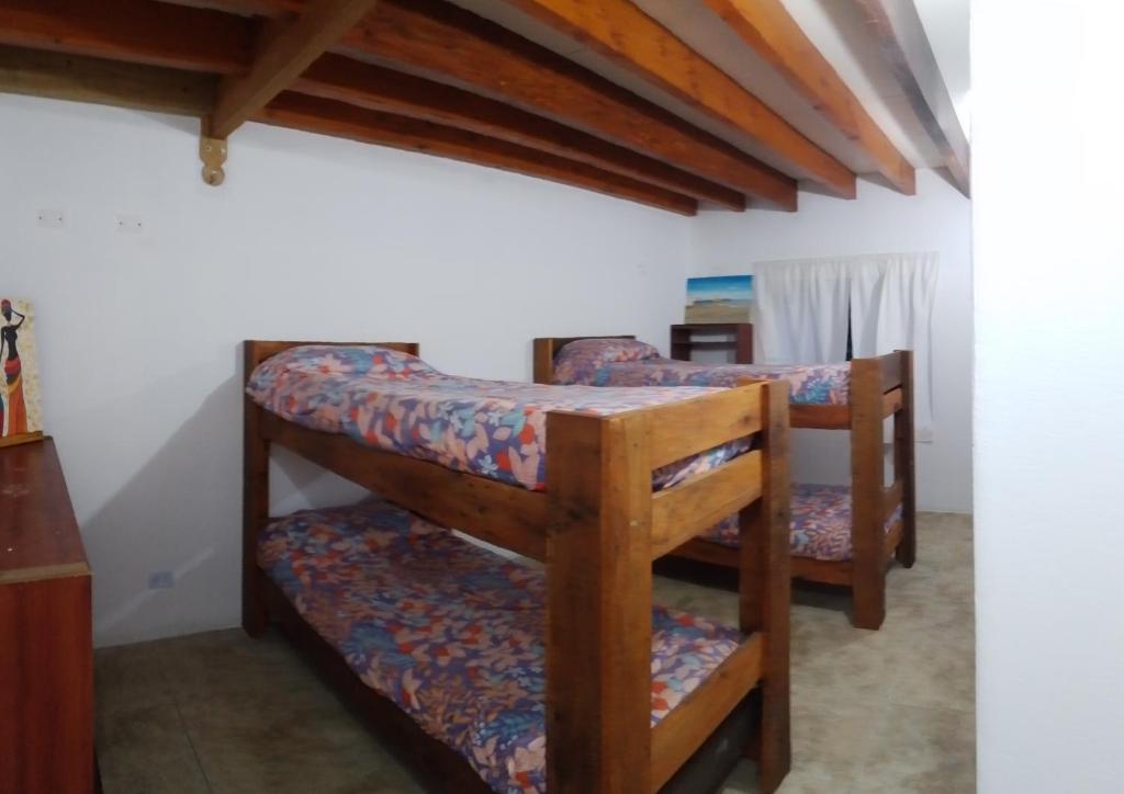 a bedroom with three bunk beds in a room at Casa Praga in Ostende