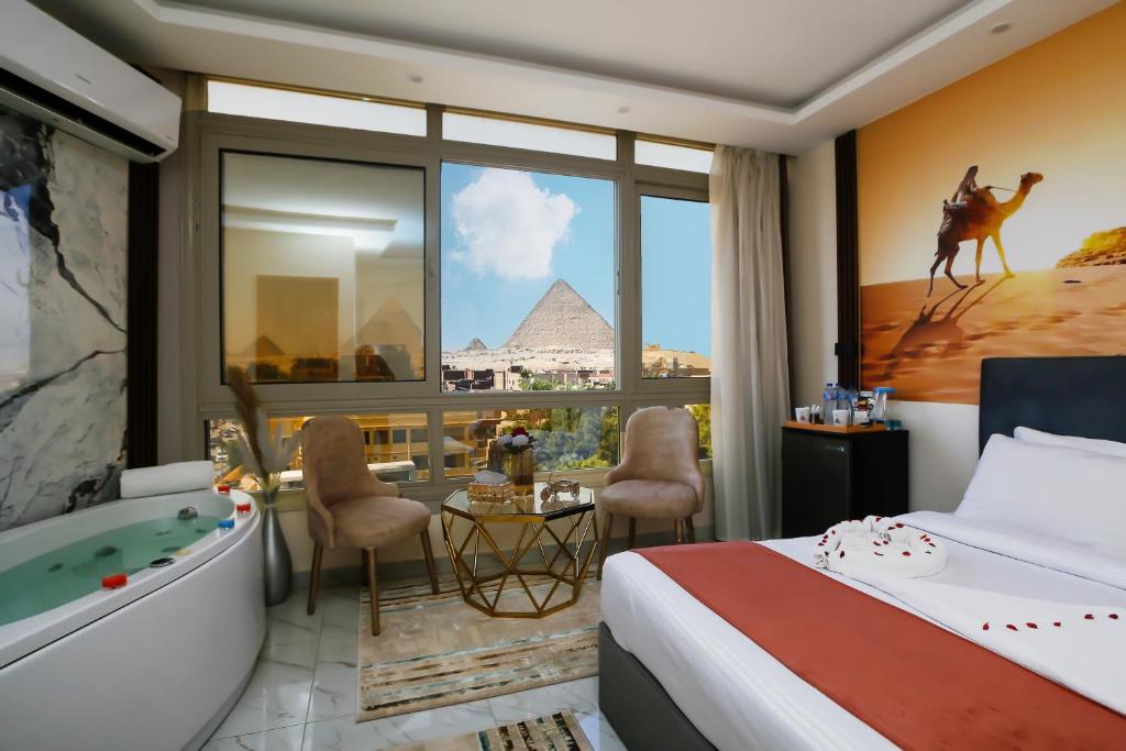 Postel nebo postele na pokoji v ubytování Pyramids Palace INN
