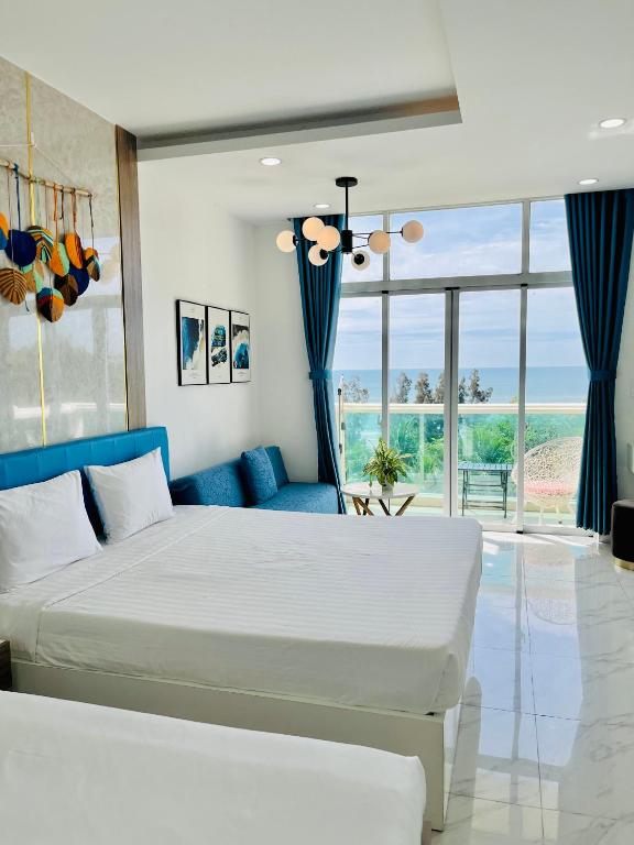 Giường trong phòng chung tại Sealiks Ocean vita muine C326