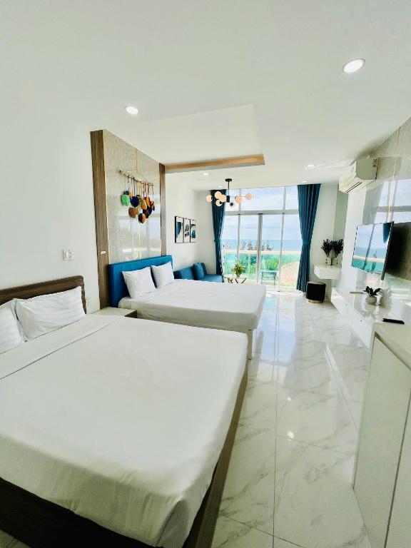 Giường trong phòng chung tại Sealiks Ocean vita muine C326