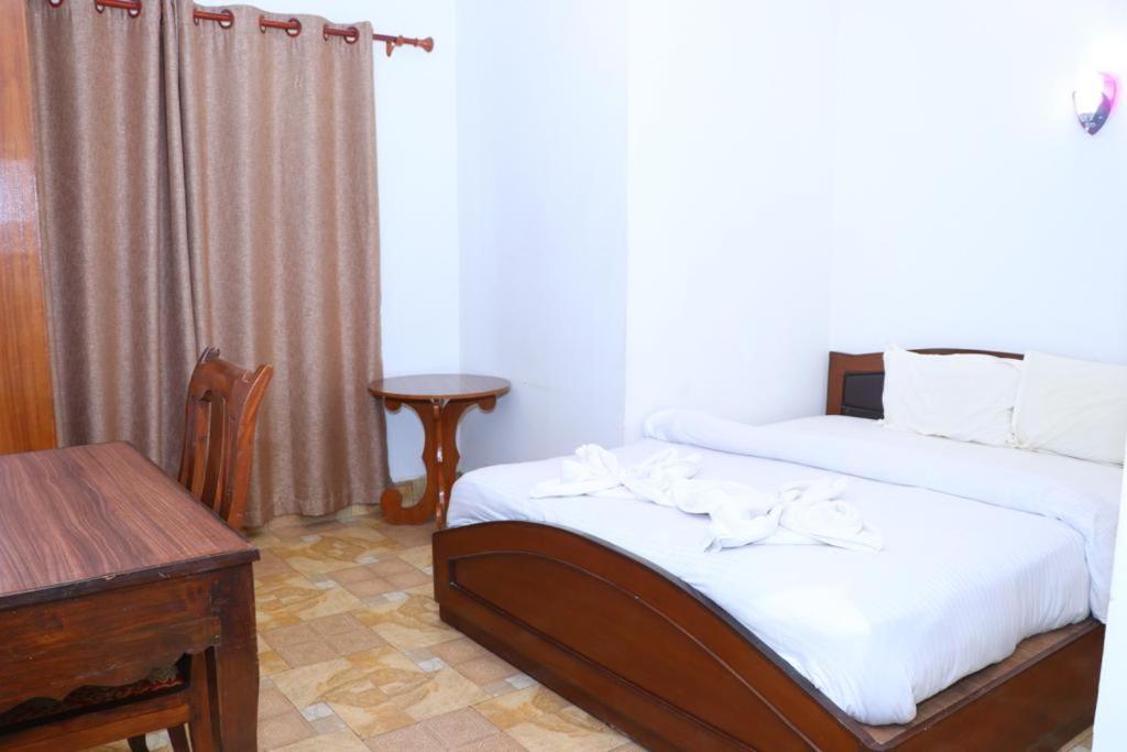 Voodi või voodid majutusasutuse Hotel Siddhartha in Lumbini toas