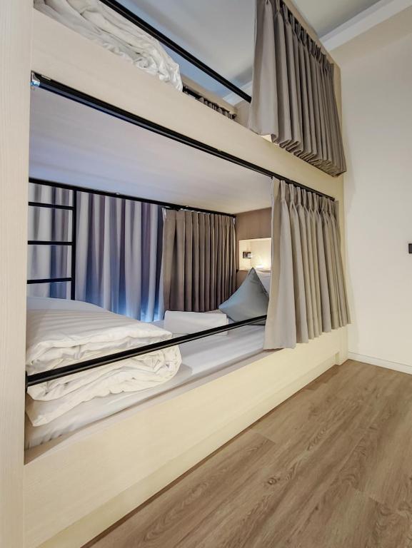 Postel nebo postele na pokoji v ubytování YAA Hostel